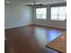 Bright living area with hardwood floors, ceiling fan, and large windows at 133 Pelican Lane, Summerville, SC 29485