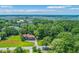 Expansive aerial view of a home surrounded by mature trees and green space at 1343 Headquarters Plantation Dr, Johns Island, SC 29455