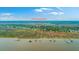Waterfront community view from above with private piers for boating and water activity access at 1343 Headquarters Plantation Dr, Johns Island, SC 29455
