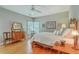 Bedroom with a large window and a white ceiling fan at 1343 Headquarters Plantation Dr, Johns Island, SC 29455
