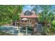 Rear exterior shot of home featuring two balconies and covered parking at 1343 Headquarters Plantation Dr, Johns Island, SC 29455