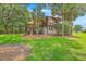 Beautiful home with lush landscaping and an outdoor patio, perfect for entertaining at 1343 Headquarters Plantation Dr, Johns Island, SC 29455
