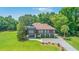 Stunning home on sprawling green lawn with mature landscaping, and convenient drive under parking at 1343 Headquarters Plantation Dr, Johns Island, SC 29455