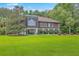 Charming two-story home with a spacious lawn, mature trees, and well-manicured landscaping at 1343 Headquarters Plantation Dr, Johns Island, SC 29455