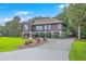 Exterior showcasing landscaping, a circular driveway and architectural design at 1343 Headquarters Plantation Dr, Johns Island, SC 29455