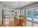 Eat-in kitchen featuring white cabinetry, stainless appliances, and access to a patio at 1343 Headquarters Plantation Dr, Johns Island, SC 29455