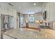 Well-lit kitchen with stainless steel appliances, granite countertops, white cabinets, and a hardwood floor at 1343 Headquarters Plantation Dr, Johns Island, SC 29455