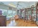 Cozy library room with bookshelves, a ceiling fan, and a large window at 1343 Headquarters Plantation Dr, Johns Island, SC 29455