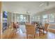 Bright living room with hardwood floors, fireplace, and large windows at 1343 Headquarters Plantation Dr, Johns Island, SC 29455