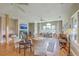 Spacious living room with a fireplace, bright windows, hardwood floors, and comfortable seating at 1343 Headquarters Plantation Dr, Johns Island, SC 29455