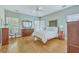 Spacious main bedroom with wood floors, a ceiling fan, and large windows at 1343 Headquarters Plantation Dr, Johns Island, SC 29455