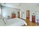 Bright main bedroom with hardwood floors and white ceiling fan at 1343 Headquarters Plantation Dr, Johns Island, SC 29455