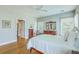 Bright main bedroom with wood floors, traditional decor, and large windows at 1343 Headquarters Plantation Dr, Johns Island, SC 29455