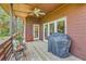 Covered porch featuring a ceiling fan, grill, and comfortable seating, great for outdoor enjoyment at 1343 Headquarters Plantation Dr, Johns Island, SC 29455