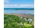 Scenic waterway view featuring waterfront homes with private docks surrounded by lush trees at 1343 Headquarters Plantation Dr, Johns Island, SC 29455