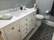 Modern bathroom with a white vanity, marble countertop, and stylish fixtures at 1389 Parkshore Dr, Charleston, SC 29407
