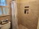 A bathroom featuring tiled walls, a shower with a curtain, and a window at 1389 Parkshore Dr, Charleston, SC 29407