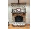 Classic brick fireplace with a wooden mantel and decorative accents, creating a warm focal point at 1389 Parkshore Dr, Charleston, SC 29407