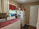 Functional laundry room with washer, dryer, and extra storage cabinets at 1389 Parkshore Dr, Charleston, SC 29407
