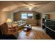 Cozy living room featuring hardwood floors, comfortable seating, and a window at 1389 Parkshore Dr, Charleston, SC 29407