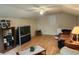 A spacious living area featuring hardwood floors, ample seating, and a large TV at 1389 Parkshore Dr, Charleston, SC 29407