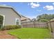 Landscaped backyard with lawn, privacy fence and mature plantings for outdoor enjoyment at 1460 Oldenburg Dr, Mount Pleasant, SC 29429