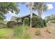 Well-maintained backyard featuring lush landscaping and a cozy, covered porch area at 1460 Oldenburg Dr, Mount Pleasant, SC 29429