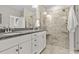 Bathroom featuring double sinks with granite countertops and tiled walk-in shower at 1460 Oldenburg Dr, Mount Pleasant, SC 29429