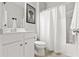Bright bathroom featuring white fixtures, a shower/tub combo, and a framed decorative art piece at 1460 Oldenburg Dr, Mount Pleasant, SC 29429