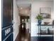 Inviting entryway features dark hardwood floors, wainscoting, and stylish console table at 1460 Oldenburg Dr, Mount Pleasant, SC 29429