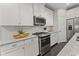 Well-appointed kitchen featuring stainless steel appliances, granite countertops, and sleek white cabinetry at 1460 Oldenburg Dr, Mount Pleasant, SC 29429