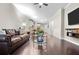 Open-concept living area featuring hardwood floors, a ceiling fan, and modern furniture at 1460 Oldenburg Dr, Mount Pleasant, SC 29429