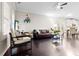 Comfortable living room featuring hardwood floors, ceiling fan, and ample natural light at 1460 Oldenburg Dr, Mount Pleasant, SC 29429