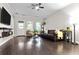 Inviting living room with hardwood floors, ceiling fan, and a leather sofa at 1460 Oldenburg Dr, Mount Pleasant, SC 29429