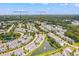 Aerial view displays a vibrant community, nestled among ponds and lush green spaces at 1582 Prince Edward St, Mount Pleasant, SC 29466