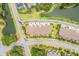 Aerial view of townhomes with well-manicured lawns nestled beside a beautiful pond at 1582 Prince Edward St, Mount Pleasant, SC 29466