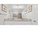 Bathroom featuring double sinks with granite countertops, and a large framed mirror at 1582 Prince Edward St, Mount Pleasant, SC 29466