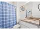 Bathroom featuring granite countertops, a white sink, toilet, and a striped shower curtain at 1582 Prince Edward St, Mount Pleasant, SC 29466