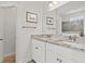 Bathroom featuring double sinks with granite countertops, and a large framed mirror at 1582 Prince Edward St, Mount Pleasant, SC 29466