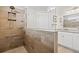 Bathroom showcasing modern wood-look tile in a walk-in shower and granite countertops on the vanity at 1582 Prince Edward St, Mount Pleasant, SC 29466