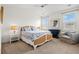 Spacious bedroom features a large bed, windows with natural light, and a comfy armchair at 1582 Prince Edward St, Mount Pleasant, SC 29466