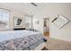 Spacious bedroom features a large bed, windows with natural light, and a modern style mirror at 1582 Prince Edward St, Mount Pleasant, SC 29466