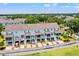 Charming townhome exteriors boast covered porches and well-maintained driveways in a lush community at 1582 Prince Edward St, Mount Pleasant, SC 29466