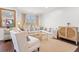 Inviting living room with a plush sectional sofa, decorative mirror, and soft lighting, ideal for relaxation at 1582 Prince Edward St, Mount Pleasant, SC 29466