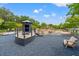 Community playground with climbing structures, lookout, boat, and seating offers an inclusive space for recreation at 1582 Prince Edward St, Mount Pleasant, SC 29466