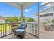 Relaxing screened porch with wicker furniture, a ceiling fan, and views of the community at 1582 Prince Edward St, Mount Pleasant, SC 29466
