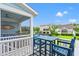 A porch with a dining table, chairs, and a view to other houses at 1582 Prince Edward St, Mount Pleasant, SC 29466