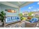 Inviting porch with comfortable seating and serene views of the neighborhood and blue sky at 1582 Prince Edward St, Mount Pleasant, SC 29466
