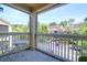 Balcony with outdoor furniture, overlooks lush landscaping and parking at 1600 Long Grove Dr # 423, Mount Pleasant, SC 29464