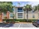 Condo exterior with balconies, lush landscaping, and mature palm trees in the parking lot at 1600 Long Grove Dr # 423, Mount Pleasant, SC 29464